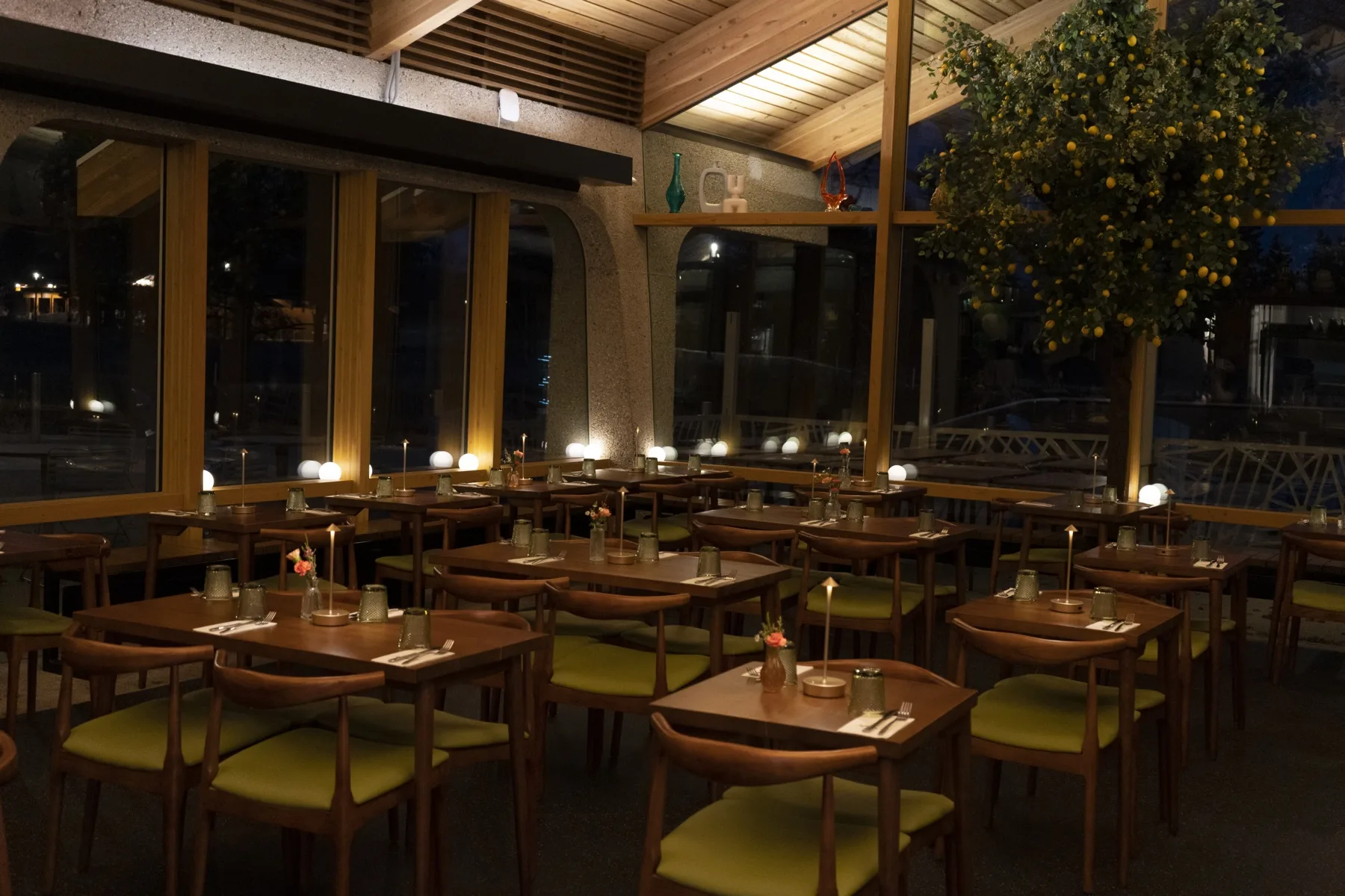 Lift Me Up On the Lake — candlelit dining room with the lemon tree, lakeside